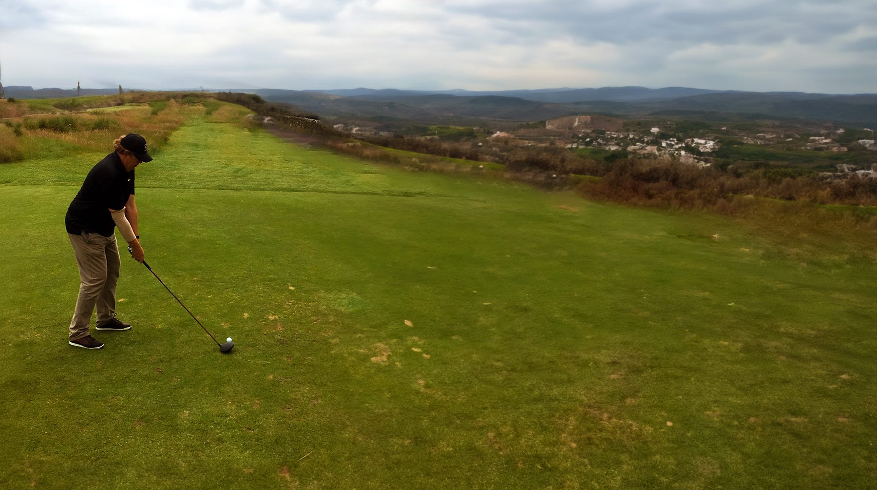 Tony Kynaston playing golf